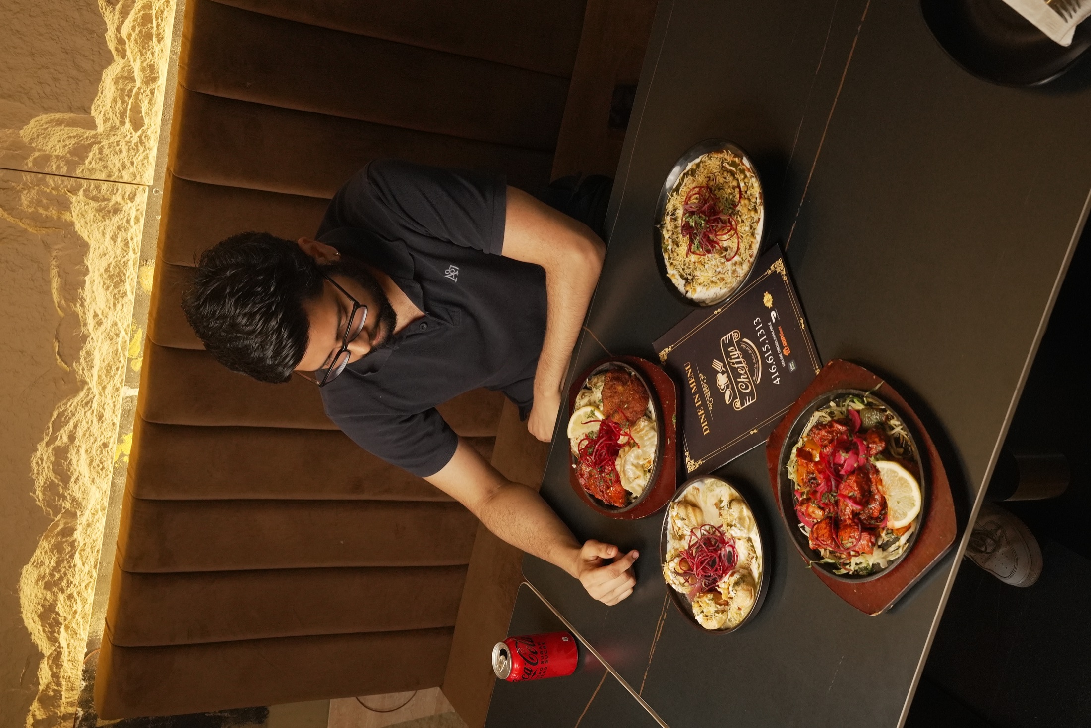 Guest enjoying a spread of Cheffys dishes inside the restaurant